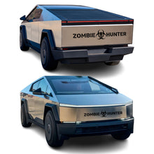 Load image into Gallery viewer, Cybertruck with zombie hunter vinyl stickers installed on the back and front of it 
